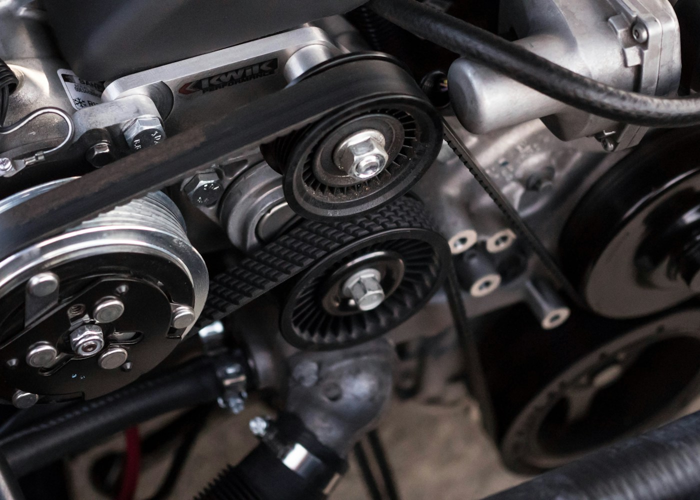 Close-up of an engine belt and pulley assembly